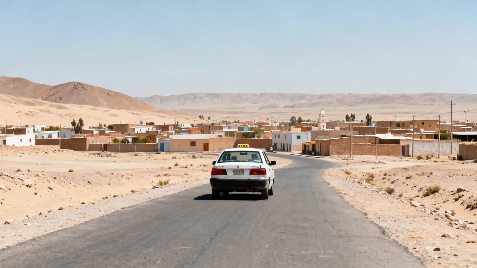 A taxi on a paved desert-town road, photographic illustration