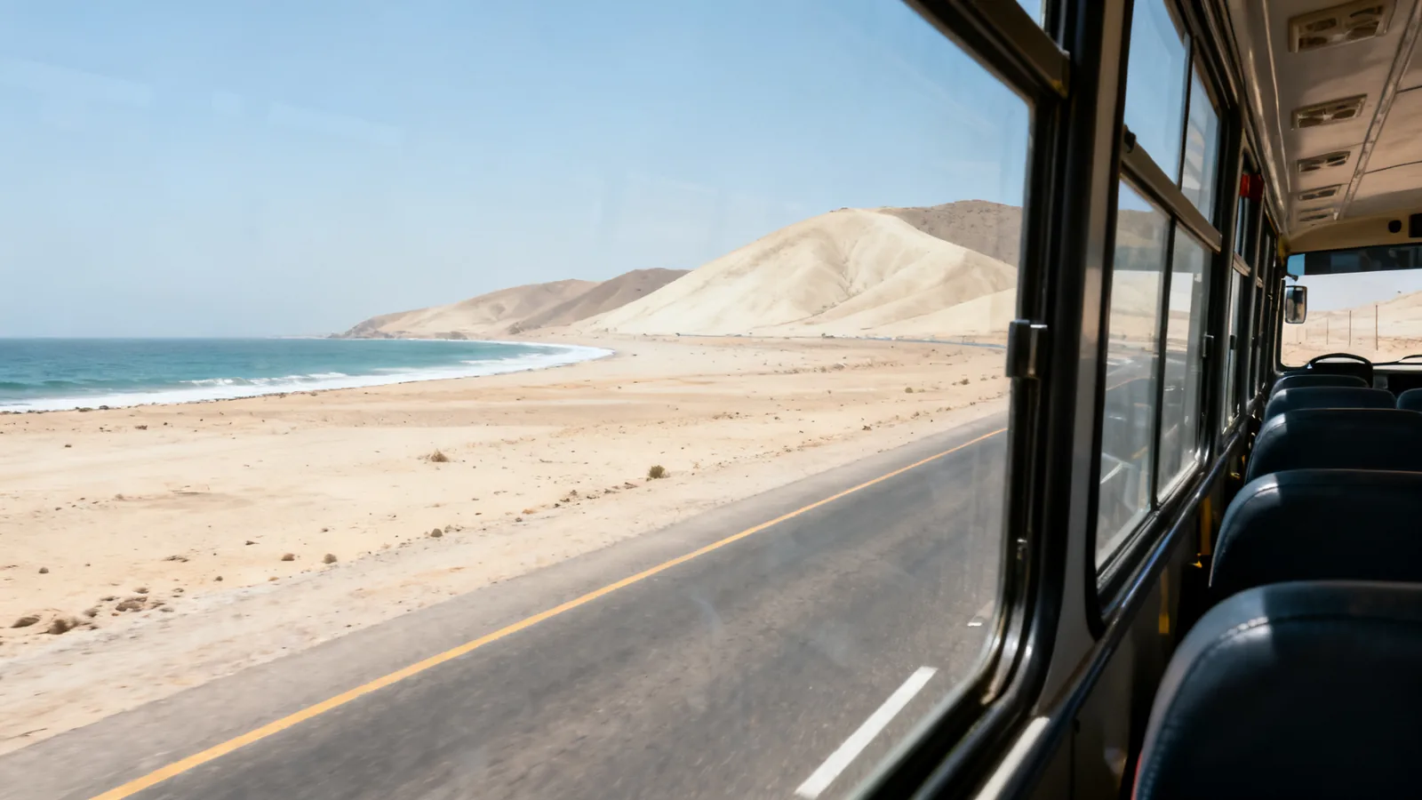 A coastal desert highway seen from a coach, photographic illustration