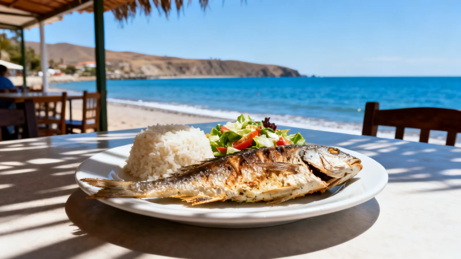 Photographic illustration of a cooked fish meal beside a coastal bay, not a shortlisted restaurant