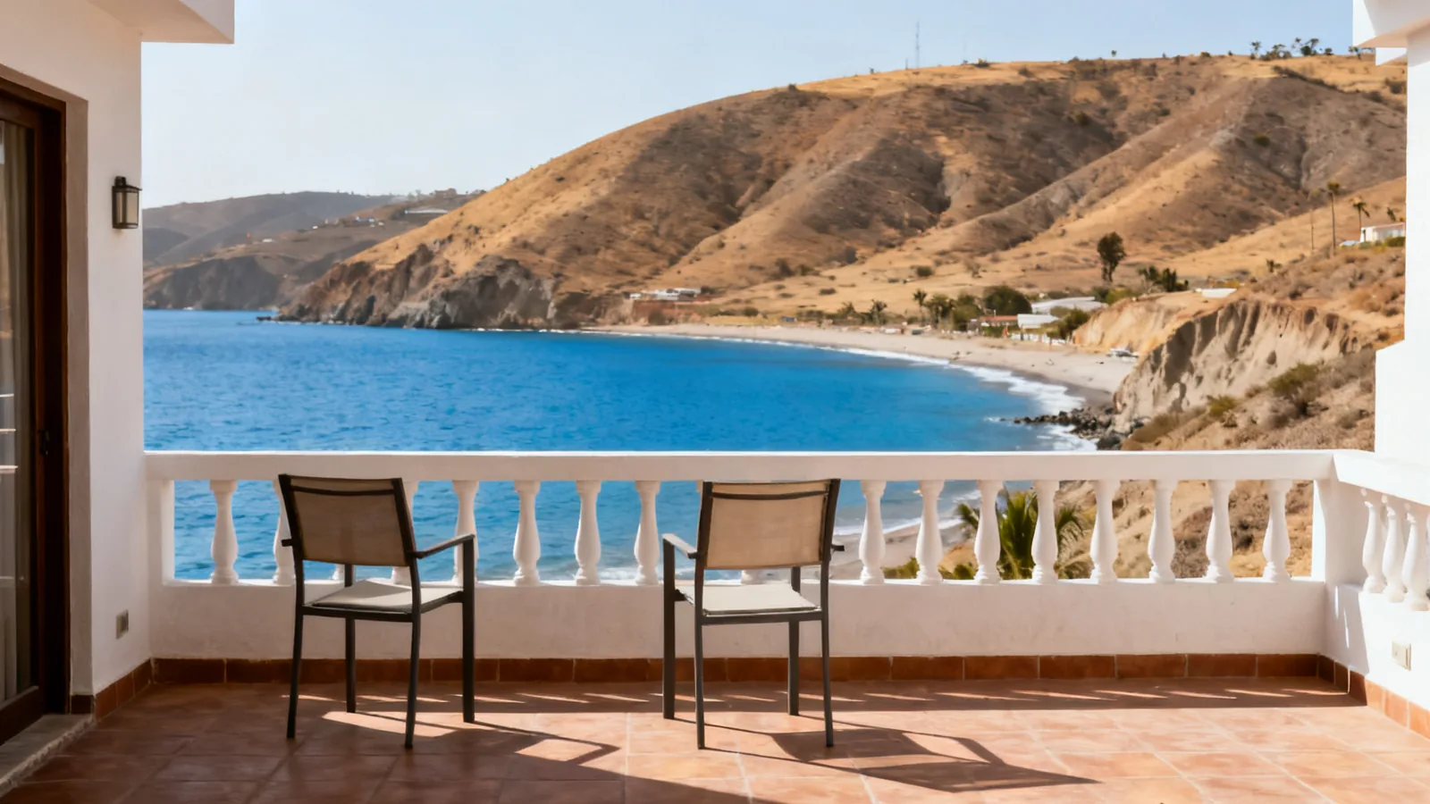 Photographic illustration of a hotel terrace facing a coastal bay, not a shortlisted property